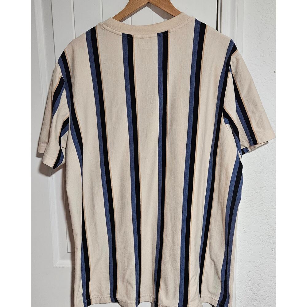 XL No Boundaries Beige shirt with multicolor stripes.